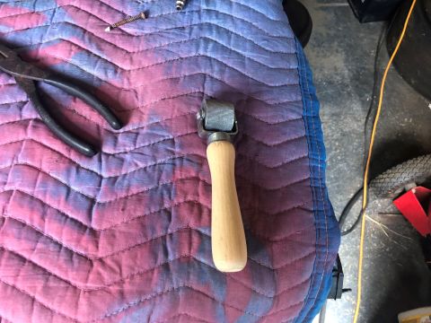 1995 Ford Bronco - Tools and small automotive parts are laid out on a quilted mat, possibly for a repair or restoration project.