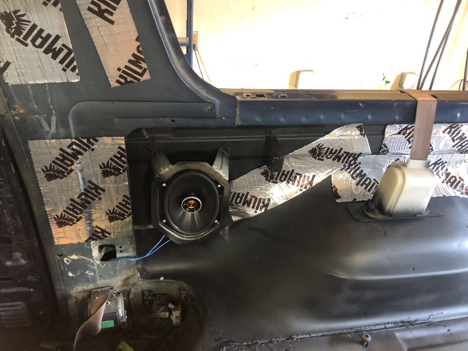 Interior door panel with sound deadening and speaker installed