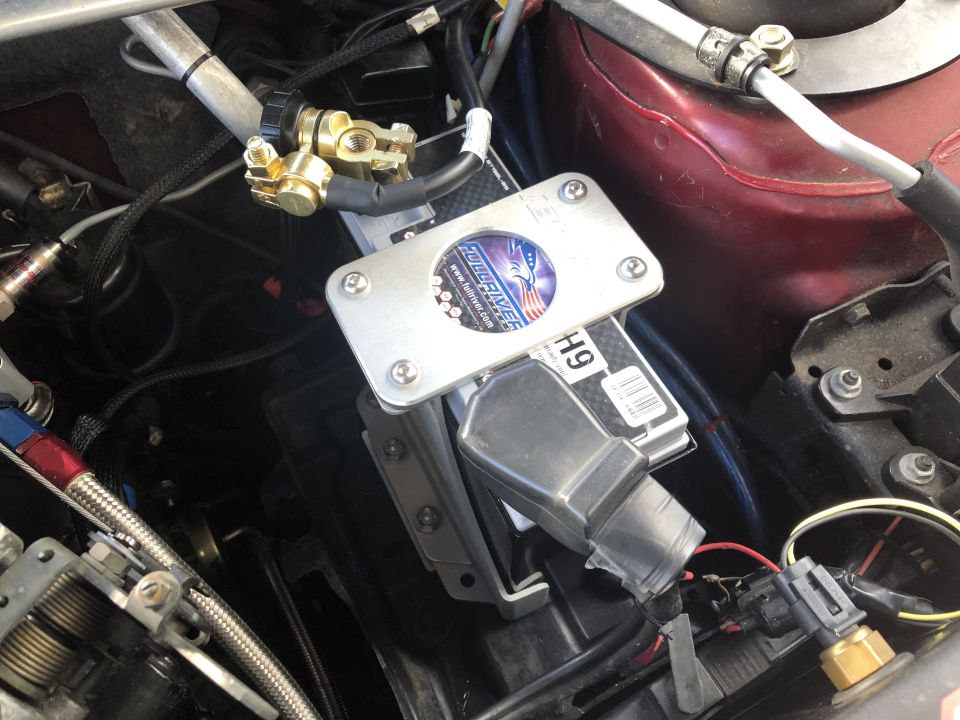 Close-up of a battery terminal with wiring and a Full River battery label