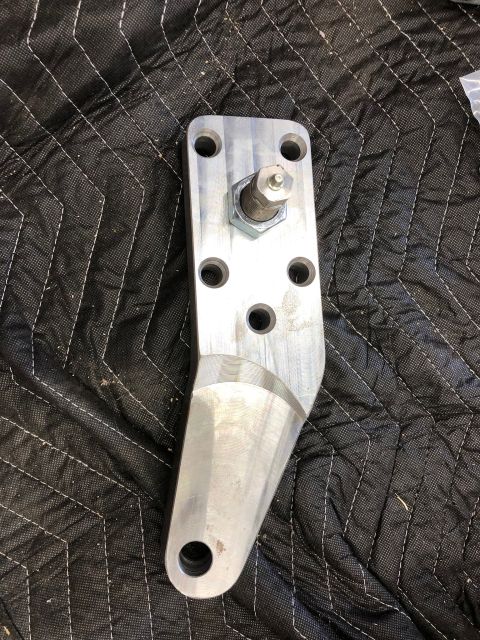 1992 Jeep Wrangler - A close-up view of a metal steering component bracket, likely for an automotive application.