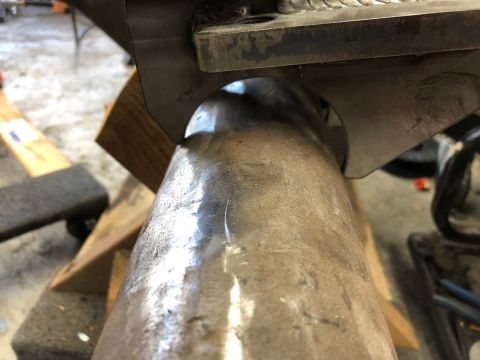 1992 Jeep Wrangler - Detail of a welded metal suspension part, likely from a Jeep Wrangler.