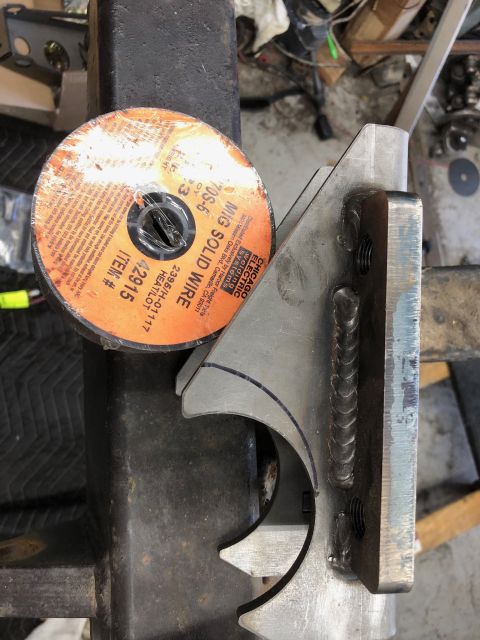 1992 Jeep Wrangler - A close-up shows a spool of welding wire and a metal bracket with visible welds.