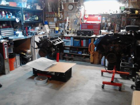 1978 Ford Bronco - Workshop scene with engines undergoing repair or rebuild.
