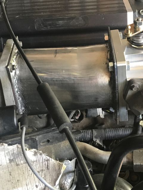 2000 Ford Explorer - Engine component with a connected cable, likely part of an intake system.