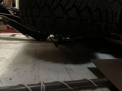1996 Ford Bronco - Undercarriage view of a 1996 Ford Bronco, showing the spare tire and suspension components.