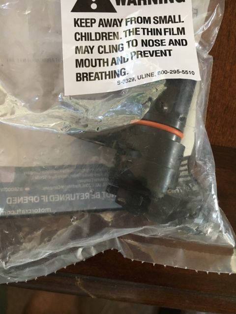 1996 Ford Bronco - Automotive sensor part in plastic packaging with a warning label about small children.