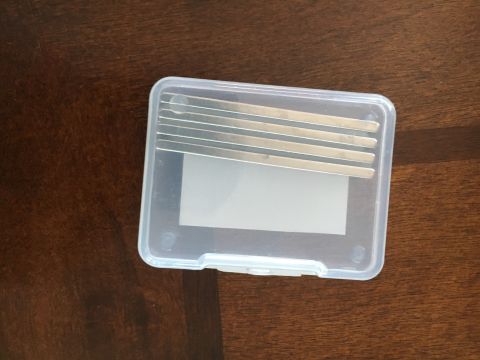 1996 Ford Bronco - A set of feeler gauges is stored inside a clear plastic case.