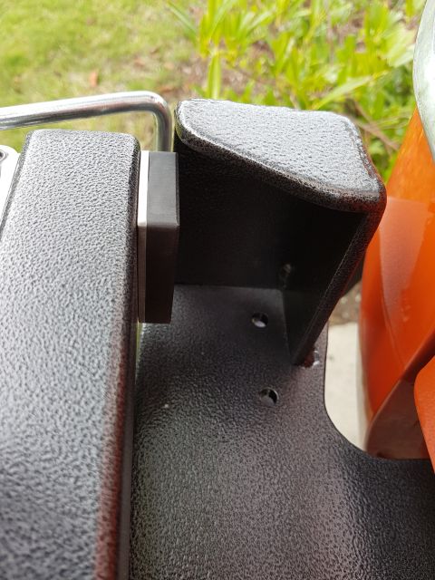1978 Ford Bronco - Textured metal bracket with attached component, possibly part of a vehicle's interior or exterior.
