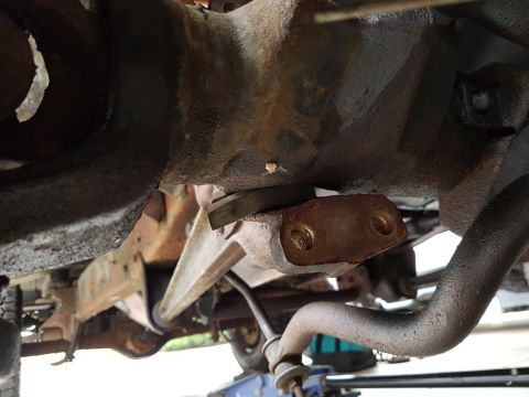 1978 Ford Bronco - Close-up of the undercarriage, showing suspension parts and a differential, with a watermark from Supermotors.net.