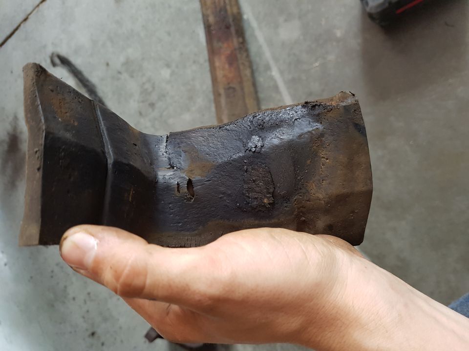 Rusted metal part held in hand