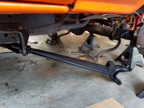 1978 Ford Bronco - Close-up of vehicle undercarriage with suspension components visible.