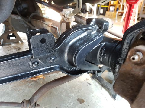 1978 Ford Bronco - A close-up view of a vehicle's suspension system, likely undergoing maintenance or restoration.