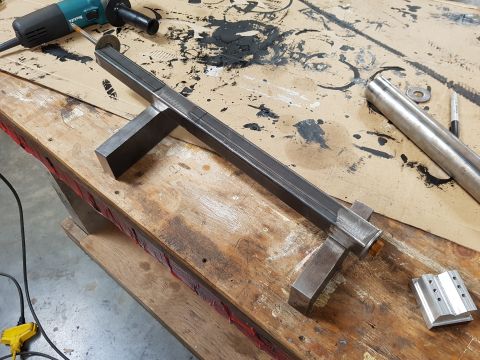 1978 Ford Bronco - Metal fabrication project in progress, with tools and raw materials on a wooden workbench.
