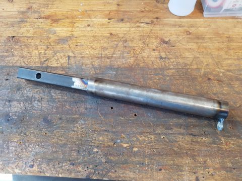 1978 Ford Bronco - Fabricated metal component on a workbench, likely for a custom build or repair project.