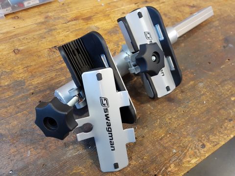 1978 Ford Bronco - Swagman bicycle trainer rollers shown on a workbench.