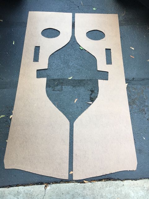 1996 Ford Bronco - Unidentified door panels, possibly for a classic vehicle, laid out on asphalt.