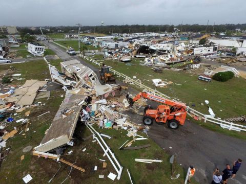 2008 Ford Focus - Construction equipment is seen at a site with destroyed mobile homes after a severe weather event.