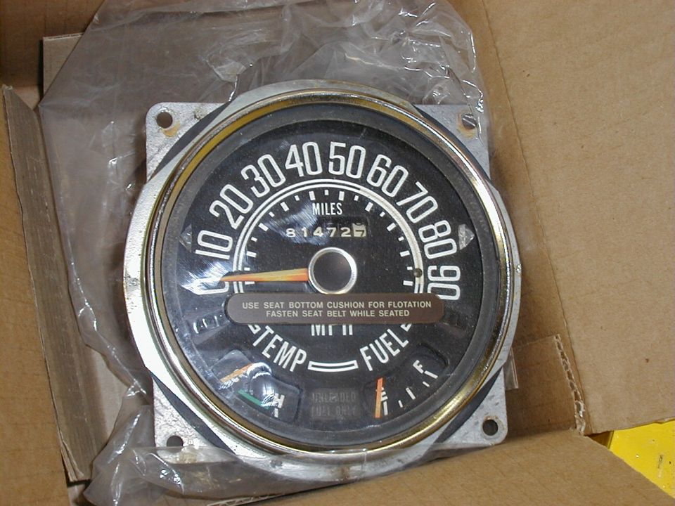 Vintage speedometer cluster in plastic bag reading 81472 miles with temp and fuel gauges