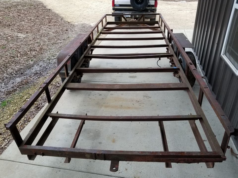 Eventually, the trailer was empty, and I started cleaning it up.  I had to grind away several welds that had been cut off, and I removed the damaged racks for the missing ramps.