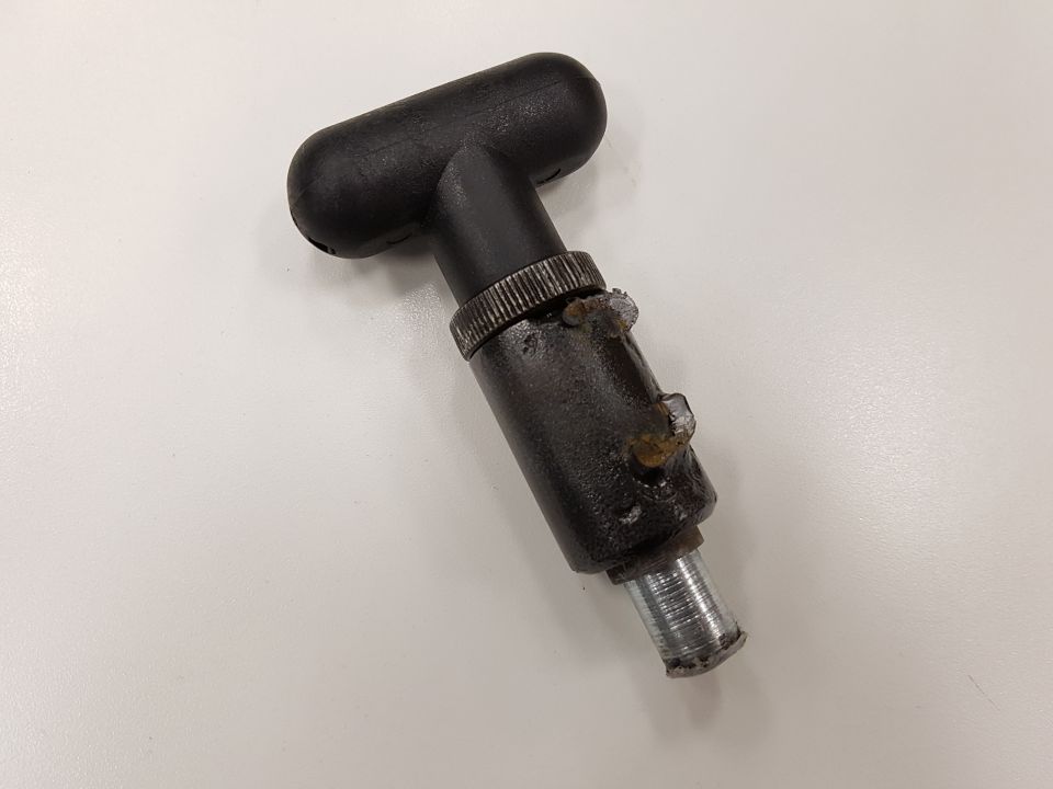 Black T-handle part with metal shaft and knurled collar