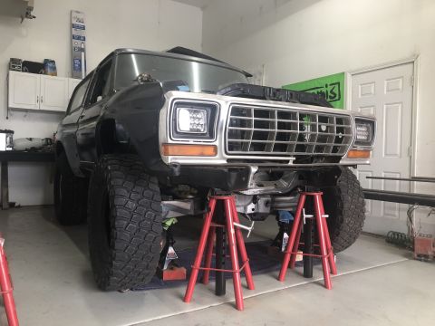 1979 Ford Bronco - Front view of a 1978 Ford Bronco undergoing maintenance in a garage.