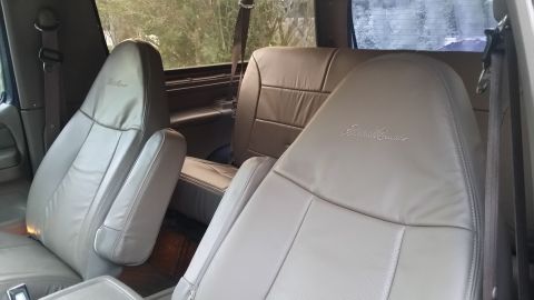 1995 Ford Bronco - The interior features leather seats with the Eddie Bauer trim, suggesting a specific package.