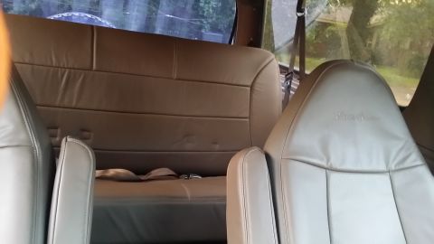 1995 Ford Bronco - Interior view of tan leather seats, including the embossed "Eddie Bauer" detail on the headrest.