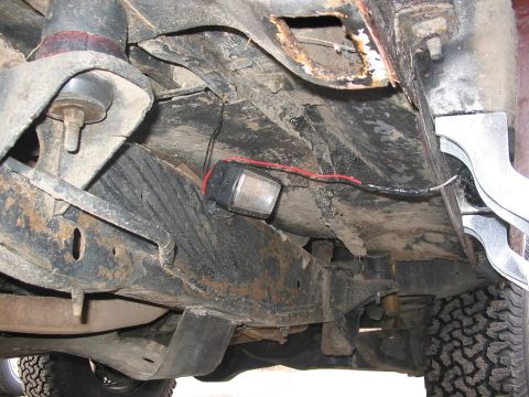 1989 Ford Bronco - Frame mounted rock light, and forward facing tire light (look by my step up)