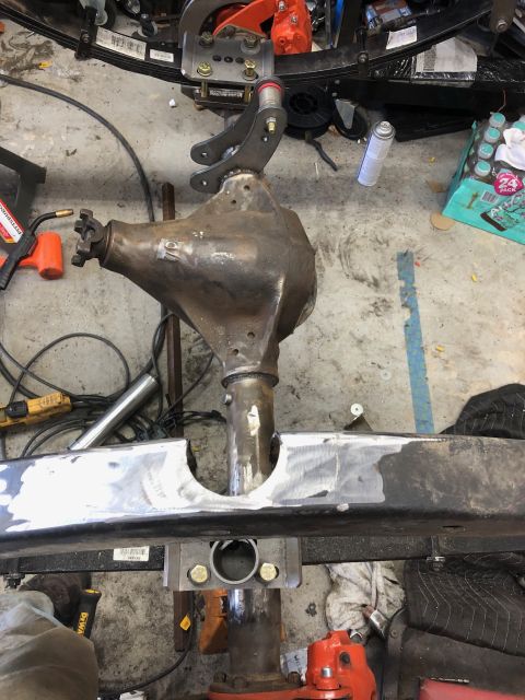 1992 Jeep Wrangler - A heavily modified Jeep Wrangler rear differential assembly is shown being welded to the frame. The assembly includes leaf springs, a diffe…