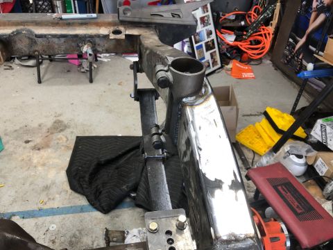1992 Jeep Wrangler - A close-up view of a vehicle frame, likely from a Jeep Wrangler, undergoing modification. The frame shows fresh welds and appears to be par…
