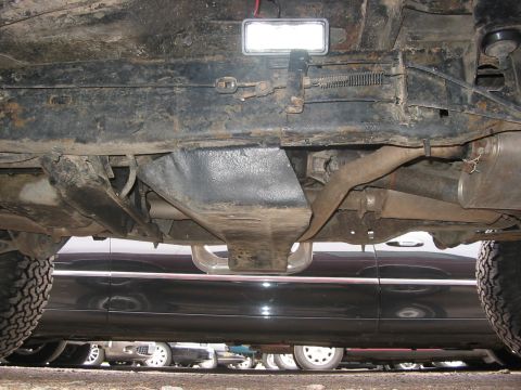1989 Ford Bronco - driver side shot of the rock light, clearing the emergency brake lines
