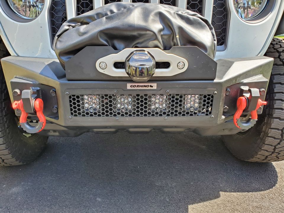Jeep Wrangler front bumper with winch, D-ring shackles, and LED lights
