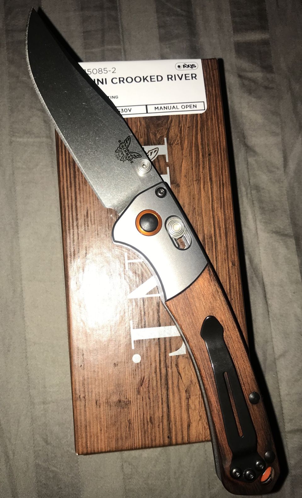 Benchmade Mini Crooked River knife on its packaging.