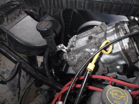 1992 Ford Bronco - Rear view of the Saginaw (and York) setup. The PS supply hose has a 90 degree fitting for a gentle approach at the pump end.