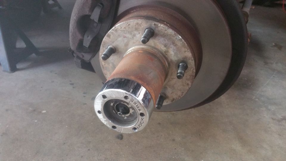 Front wheel hub assembly with a chrome locking mechanism labeled "FREE" and "LOCK"