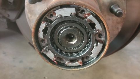 1996 Ford Bronco - This is a close-up view of a vehicle's front wheel hub assembly, showing its internal mechanical components.