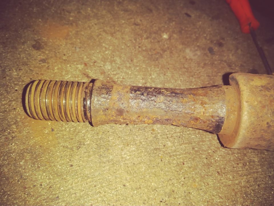 Rusted suspension part with threaded end