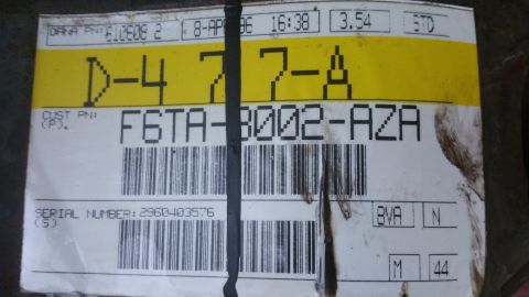 1996 Ford Bronco - A close-up of a part label shows alphanumeric codes and a serial number.