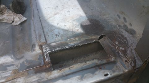 1996 Ford Bronco - The interior floor pan shows signs of rust and recent welding repairs.
