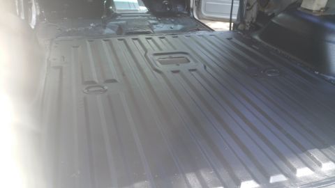 1996 Ford Bronco - Vehicle interior floor, possibly undergoing restoration or cleaning.