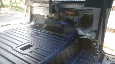 1996 Ford Bronco - The interior of a vehicle appears to be stripped down for work or modification.