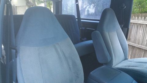 1996 Ford Bronco - Front seats and armrests visible inside a 1996 Ford Bronco.