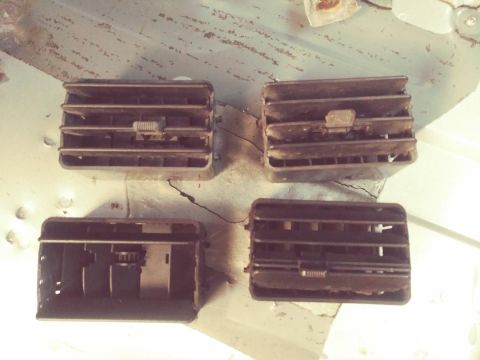 1996 Ford Bronco - Four dark brown plastic air vents are shown, with the top two in focus and the bottom two slightly blurred.