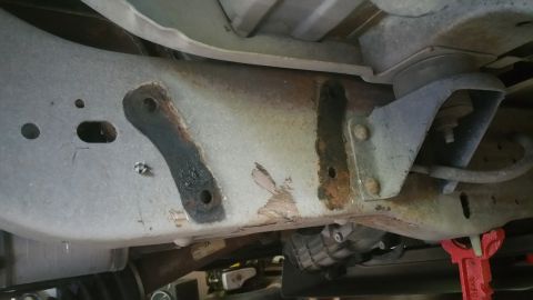 1996 Ford Bronco - Close-up view of the undercarriage, showing the vehicle's frame and suspension system.