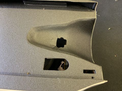 1923 Ford Model T - Interior panel with openings for controls, likely from a custom or modified vehicle.