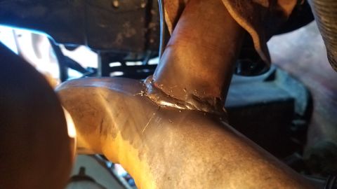 1985 Ford Bronco - Close-up view of a welded exhaust pipe, likely part of a vehicle's repair.