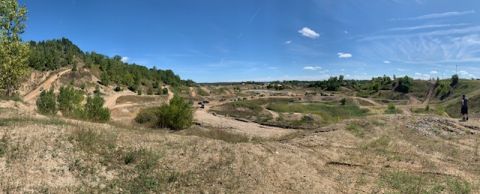 1996 Ford Bronco - A panoramic view of a challenging off-road park with multiple tracks and terrain variations.