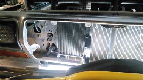 1978 Ford Bronco - Close-up view of the front grille and radiator assembly of a truck, with a visible Supermotors.net logo.