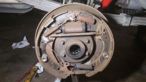 1996 Ford Bronco - This image shows the interior of a drum brake assembly for a 1996 Ford Bronco. The brake drum has been removed, revealing the brake shoes,…
