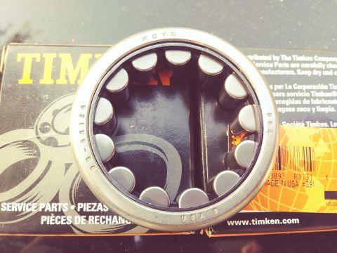 1996 Ford Bronco - A close-up shot shows a Timken brand bearing with the KOYO logo visible on the inner ring, resting on a Timken Service Parts box. The box h…